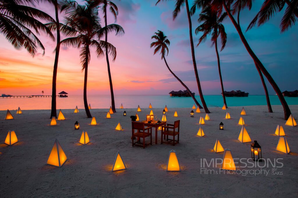 Gili Lankanfushi maldives Hero Shot magical beachfront dinner setting at sunset