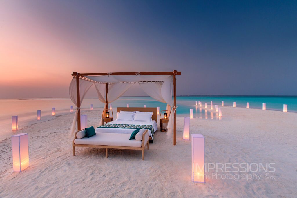 luxury resort photography case study Milaidhoo Maldives hero shot Sleeping under the stars on a private sandbank with a stunning four-poster bed